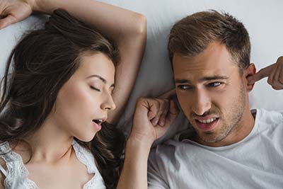 man awake at night from his wife's sleep apnea