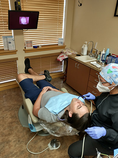patient getting their teeth cleaned at Beelman Dental in Bedford, TX