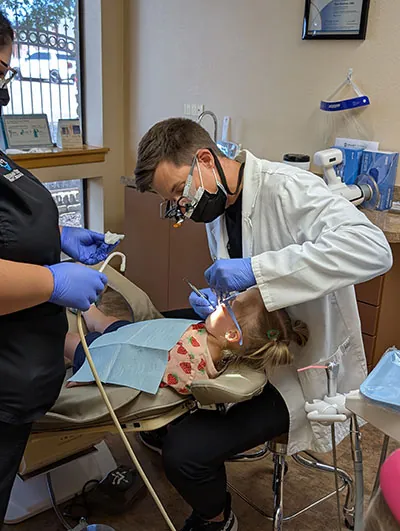 Dr. Beelman performing sedation dentistry on a pediatric patient