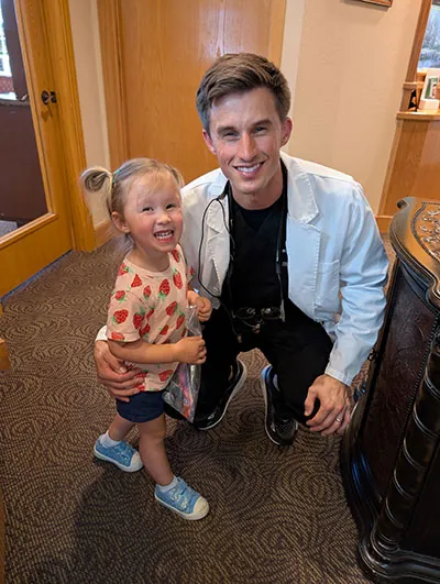 Dr. Beelman with pediatric dental patient smiling